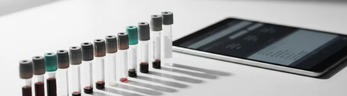 Blood sample collection vials arranged on a clean lab bench